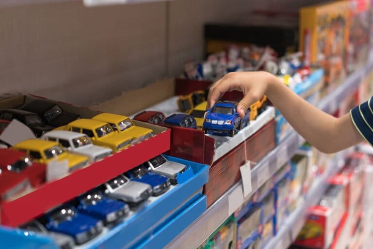 Boy choosing toys in the store Boy choosing toys in the store