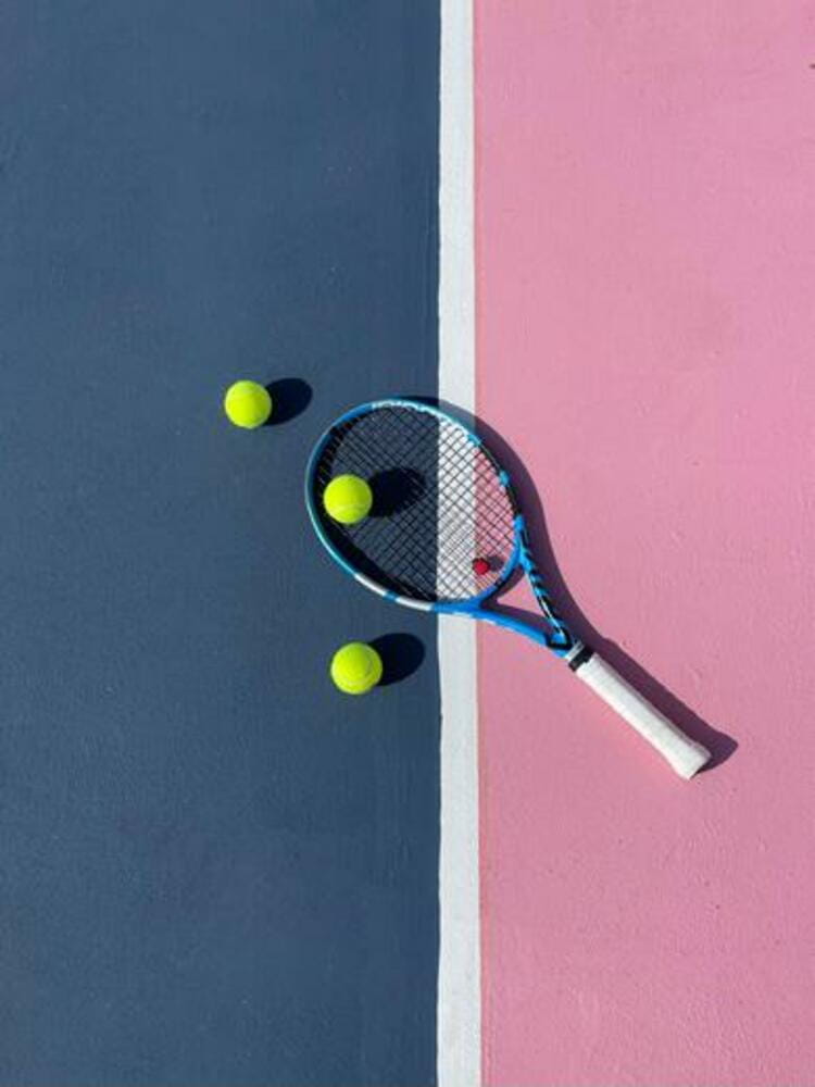 Tennis Racquet and Tennis Balls on Tennis Court Tennis Racquet and Tennis Balls on Tennis Court
