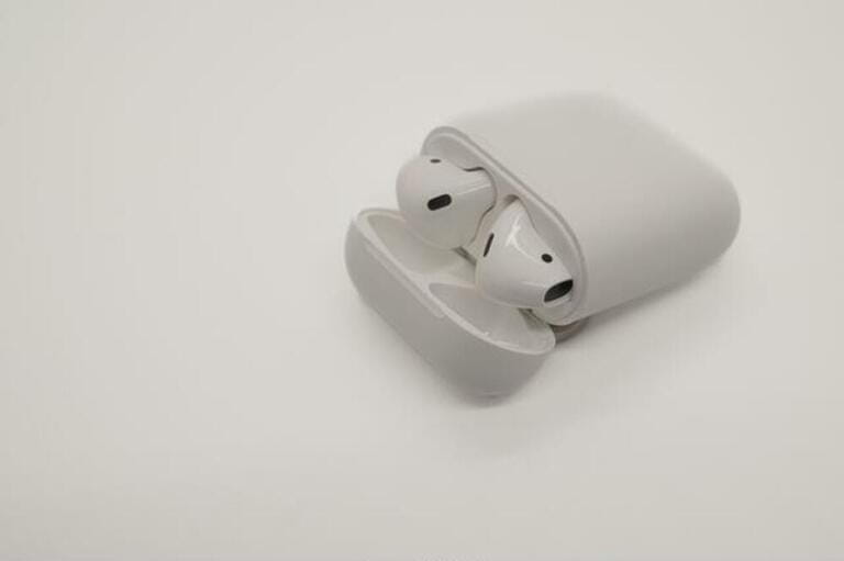 wireless earbuds in a case on a white background wireless earbuds in a case on a white background